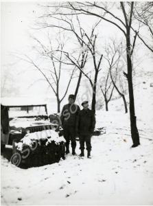 Captain Littlewood's jeep in snow with his batman
