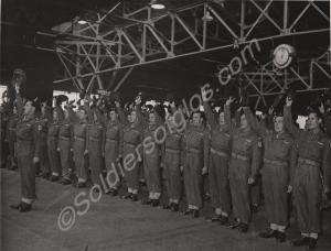 Troops cheering former P.O.W'S from Korea at South
