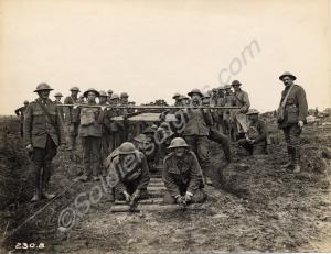 Working party of Canadian soldiers laying track fo