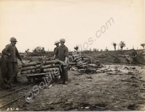 60 pounder artillery shells being loaded onto a na