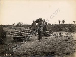 60 pounder artillery shells being loaded onto a na