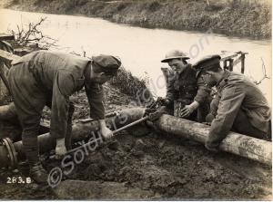 Repairing leaking water pipe.  Belgium 1916-1918.