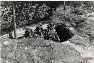 3 inch mortar crew in slit trench. Gloucestershir
