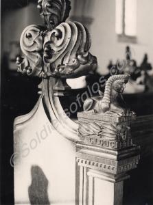 Carved Gloucestershire Regiment sphinx on a pew in