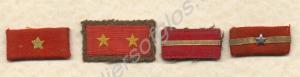 Four Japanese badges of rank, taken from a dead Ja