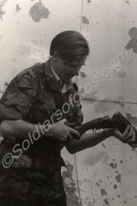 Lieutenant-Colonel Simon Firth loading shotgun. Gl