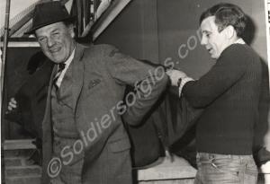 Trying on his flak jacket. Visit to the Gloucester