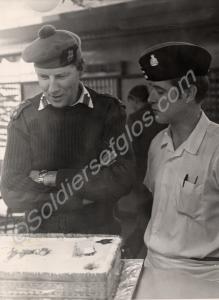 Brigadier inspecting Christmas cake.  Gloucestersh
