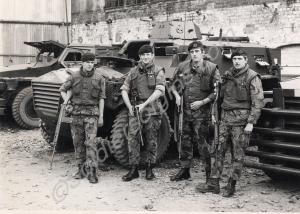 Four soldiers with Humber Pig Armoured Personnel C