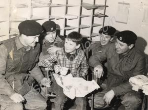 Soldiers and boy with a bag of chips.  Gloucesters