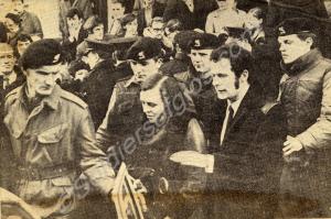 Miss Bernadette Devlin escorted by troops, after b
