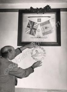 An embroidery showing the colours of the regiment,