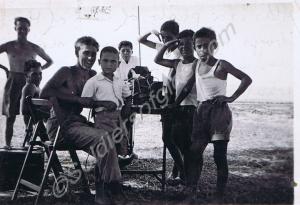 Lance-Corporal Reg Hazzell with local children.  1