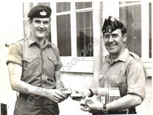 Company Sergeant Major Matthews presenting cigaret