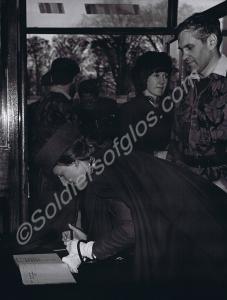 The Duchess of Gloucester signing the visitors' bo