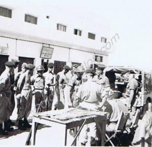 Pay Parade in the main street. 11 Platoon, "D"' Co