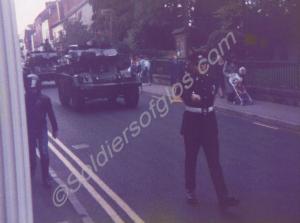 Fox armoured cars of the Recce platoon driving pas