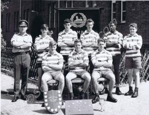 "B" Company Tug of War team. Left to right, top to