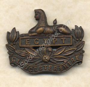 Officer's bronze front cap badge. Gloucesteshire R