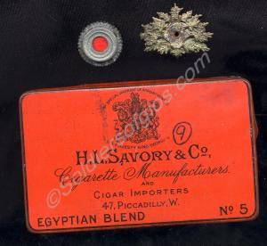 German cap roundel and badge in a red tin cigarett
