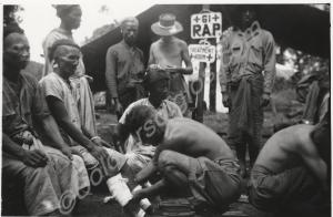 Regimental Aid Post. Vic Bendall treating Burmese