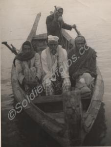 Four men in a boat. Burma. 1944-1945.