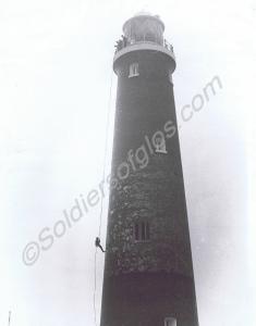 Abseiling down Dungeness lighthouse. Gloucestershi