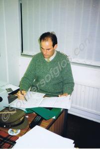 Officer seated at desk. Gloucestershire Regiment.