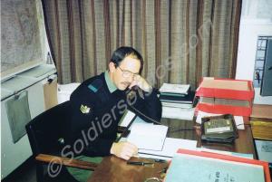 Company Sergeant Major seated at desk. Gloucesters