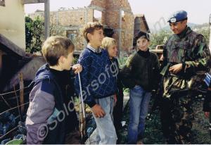Private Marvin Grange with local children.  Royal