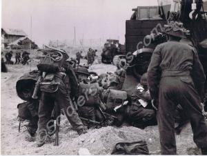 Allied troops on the beaches preparing to go inlan