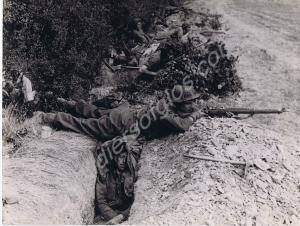 British troops in slit trenches in the forward are