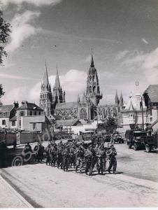 British troops marching through Bayeux. Normandy.