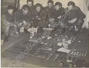 Soldiers with captured paramilitary small arms and