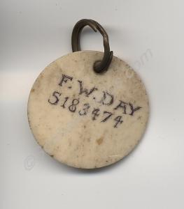 White plastic identity disc of Pte. F.W. Day (5183