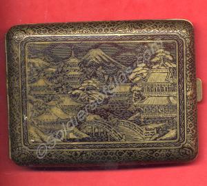 Black cigarette case with brass inlay. Chinese or