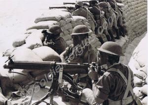 Manning a sandbagged defensive position.  2nd Batt