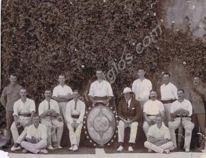 Cricket team with trophy. 1st Battalion, The Glouc