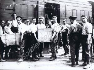 Loading ammunition onto a train. 12th Battalion, T