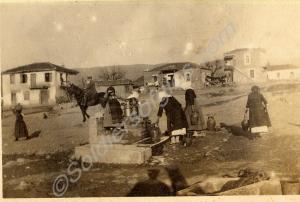 "Capudsila".  Women and children drawing water fro