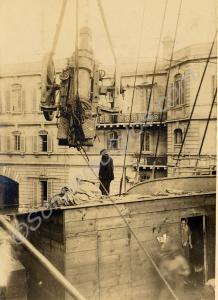 Loading artillery on board ship. Valetta, Malta.
