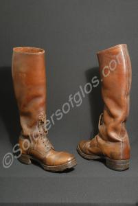 Pair of long brown boots belonging to belonging to