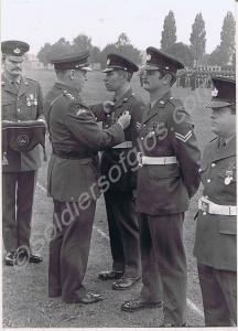 Corporal J. Taylor being presented with his Long S