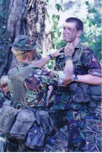 Preparing for jungle patrol. Gloucestershire Regim