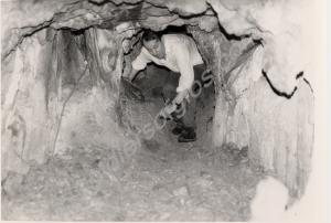 Lieutenant Colonel P R Rostron exploring a cave in