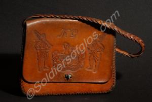 Hand-made leather holdall with strap and carving t