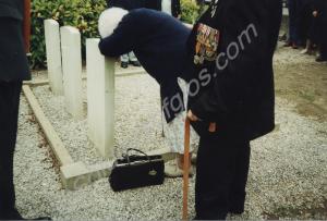 Photograph of Mrs. M. Goodall at graveside, on the