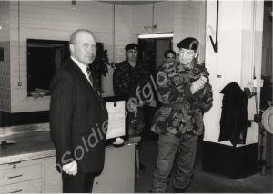 Brigadier Oliver presenting Corporal Carlisle with