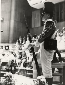 Photograph of a soldier standing guard in the old