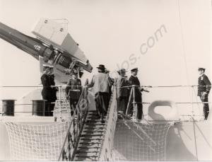 The Duchess of Gloucester going aboard H.M.S. Glou